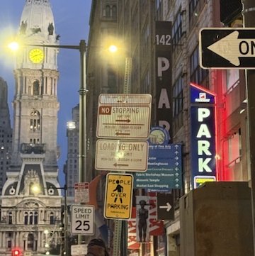 PEOPLE OVER PARKING - Photo